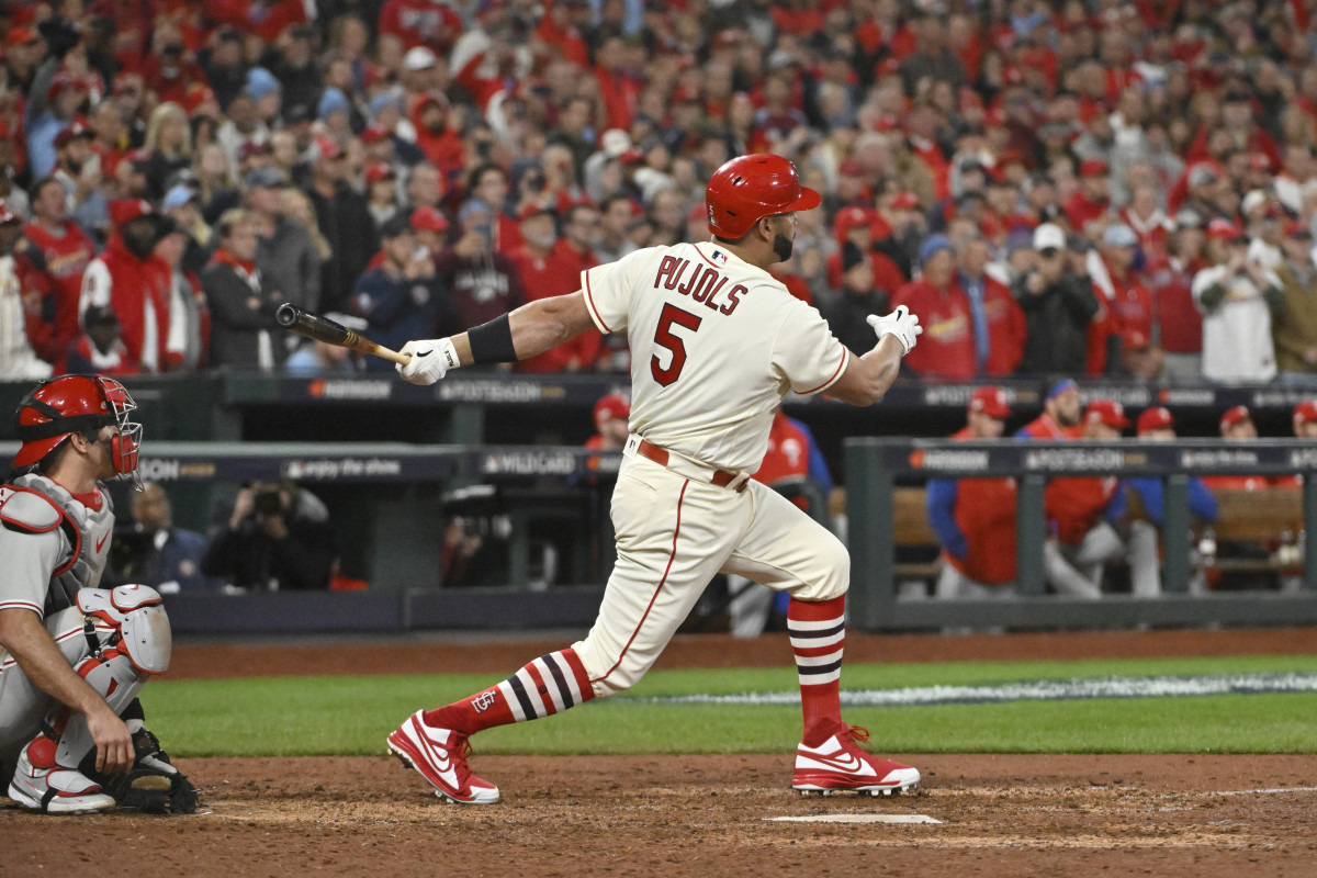 St. Louis Cardinals designated hitter Albert Pujols finishes his swing with the bat in his left hand